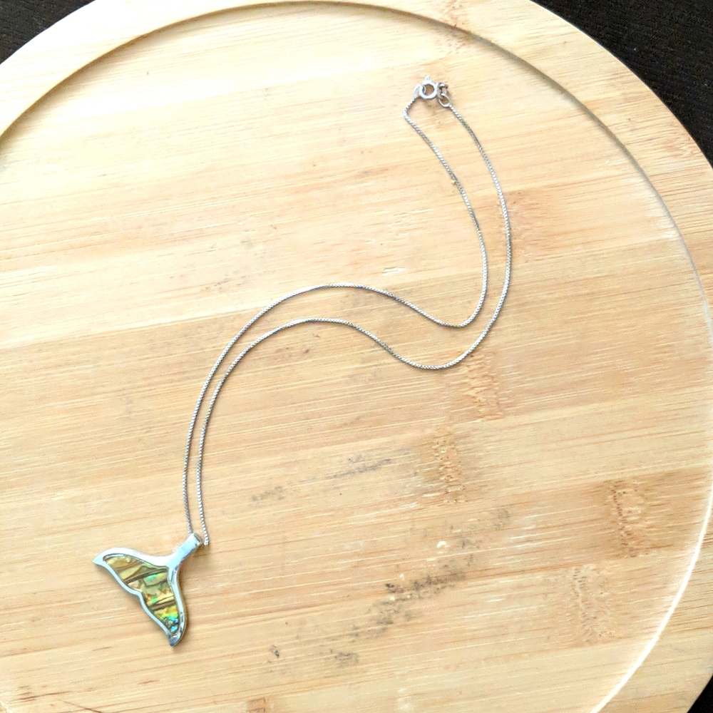 Necklace with mermaid tail pearl charm.